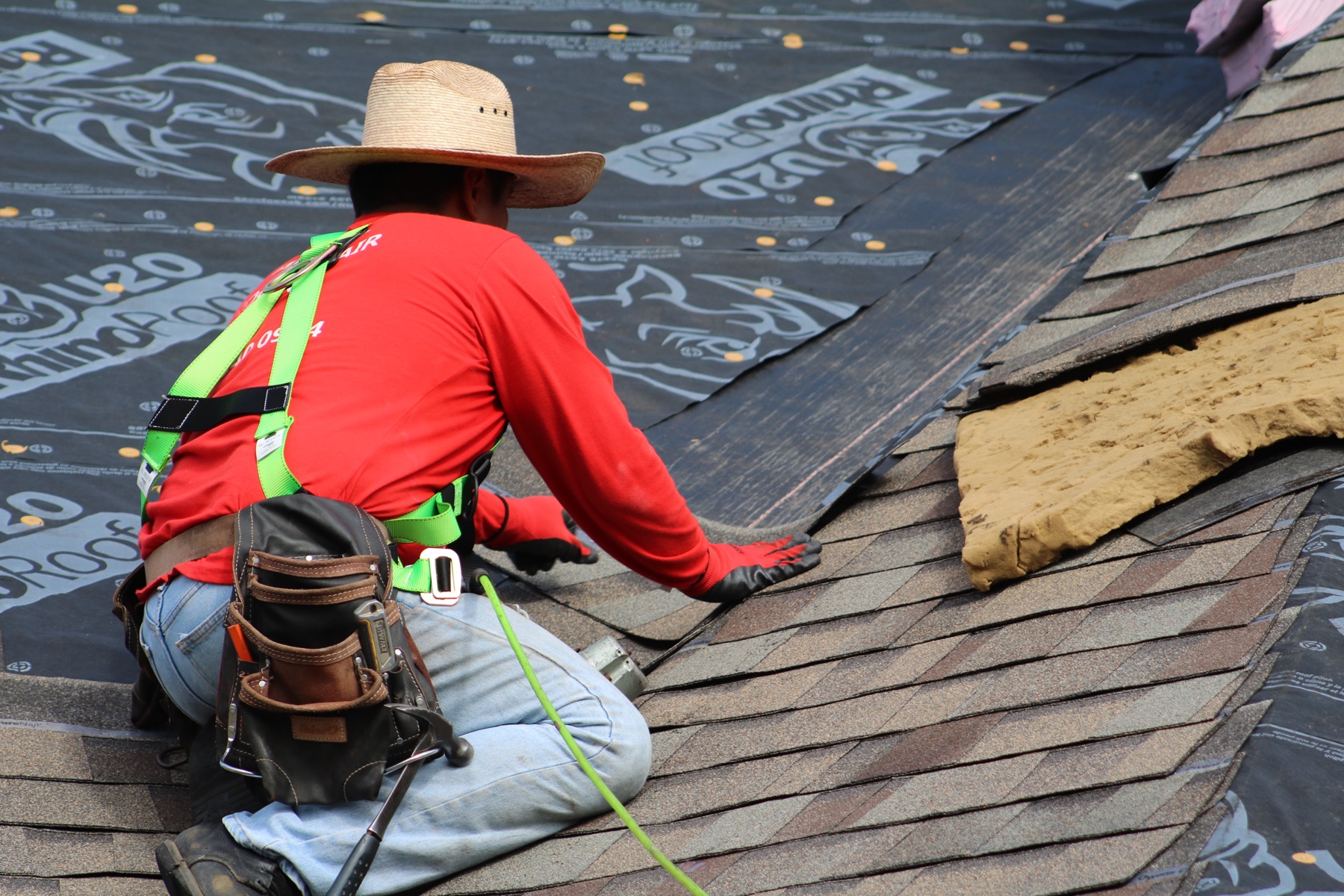 A licensed RoofSquad roofer working on a home's roof