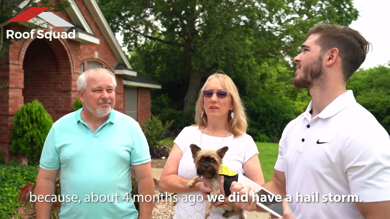 Katy homeowners and a RoofSquad representative talking in front of their home after a hail storm